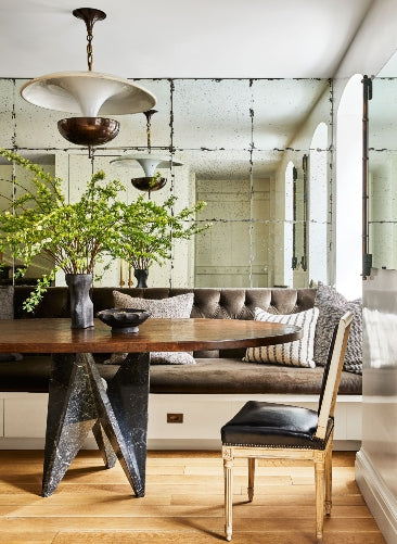 A modern and organic dining scene designed by Nate Berkus and Jeremiah Brent.
