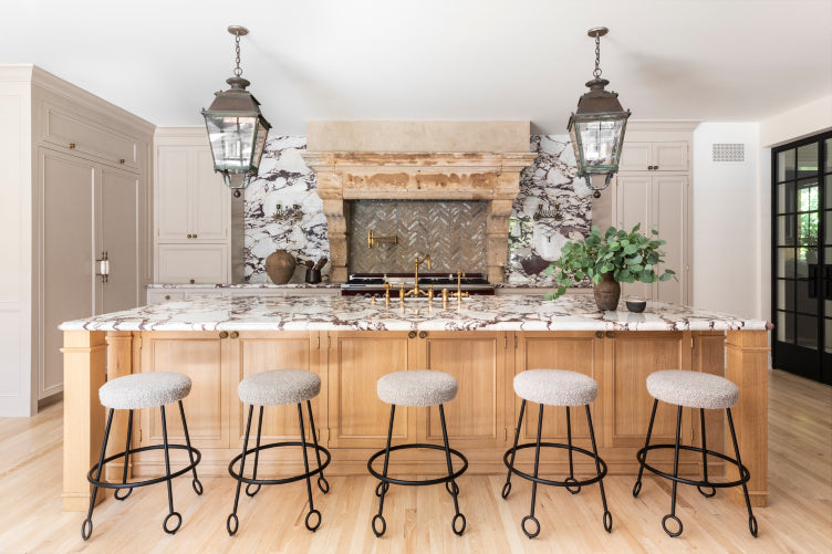 Wood tones and natural stone abound in this modern-meets-rustic kitchen by Nate Berkus and Jeremiah Brent.