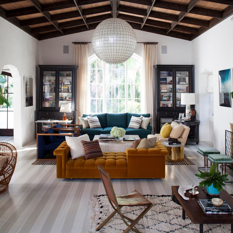A relaxed and distinctly curated living room with ample seating and visual interest, designed by Nate Berkus Associates. 