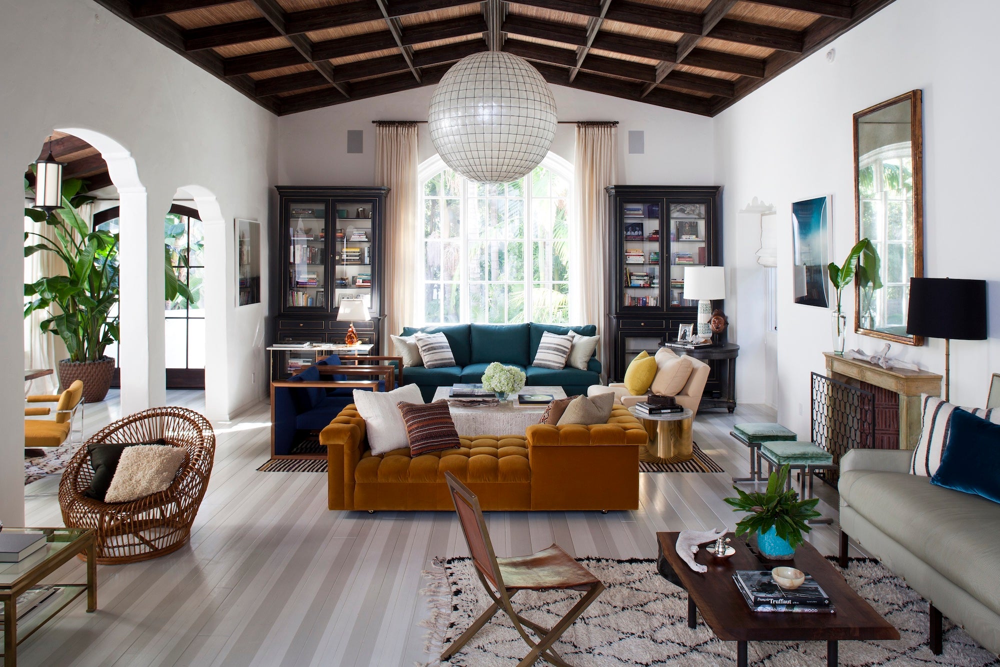 A relaxed and distinctly curated living room with ample seating and visual interest, designed by Nate Berkus Associates. 