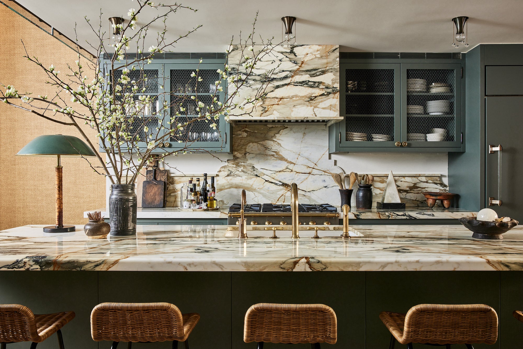 A West Village kitchen designed by Nate Berkus and Jeremiah Brent that juxtaposes rustic materials with clean lines and neutral tones with unexpected blues.