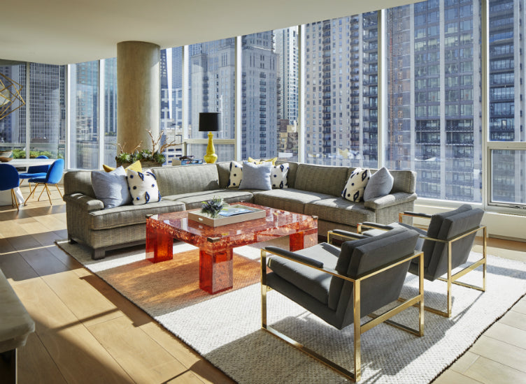 This modern Chicago apartment, complete with floor-to-ceiling windows, is infused with warmth with layered furnishings and textures. Designed by Nate Berkus Associates.