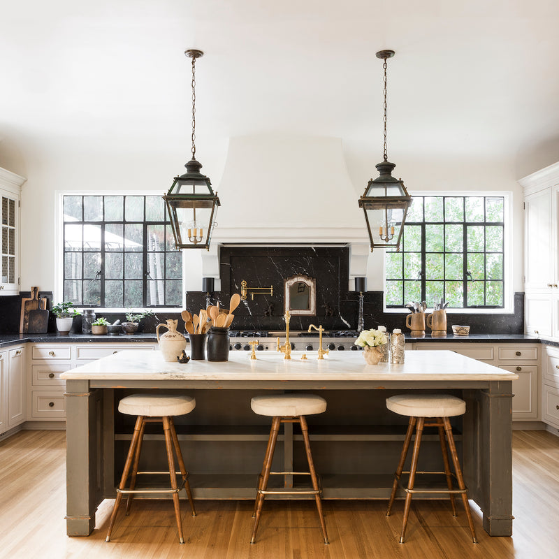 A kitchen by Nate Berkus and Jeremiah Brent that layers neutral tones, organic materials, and timeworn finishes.