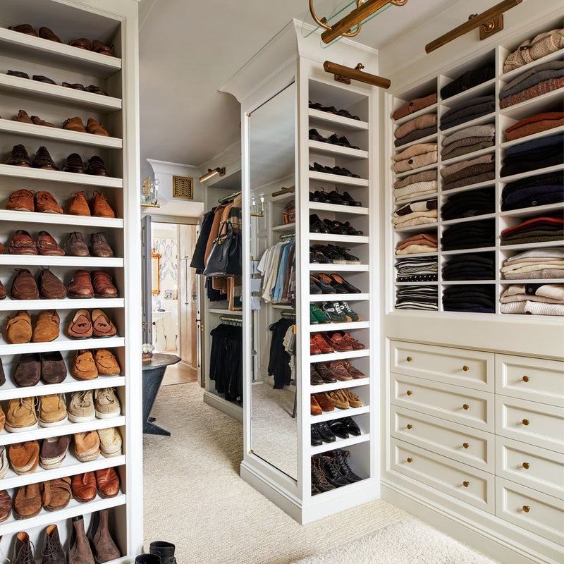 A custom walk-in closet with timeless finishes by Nate Berkus and Jeremiah Brent.