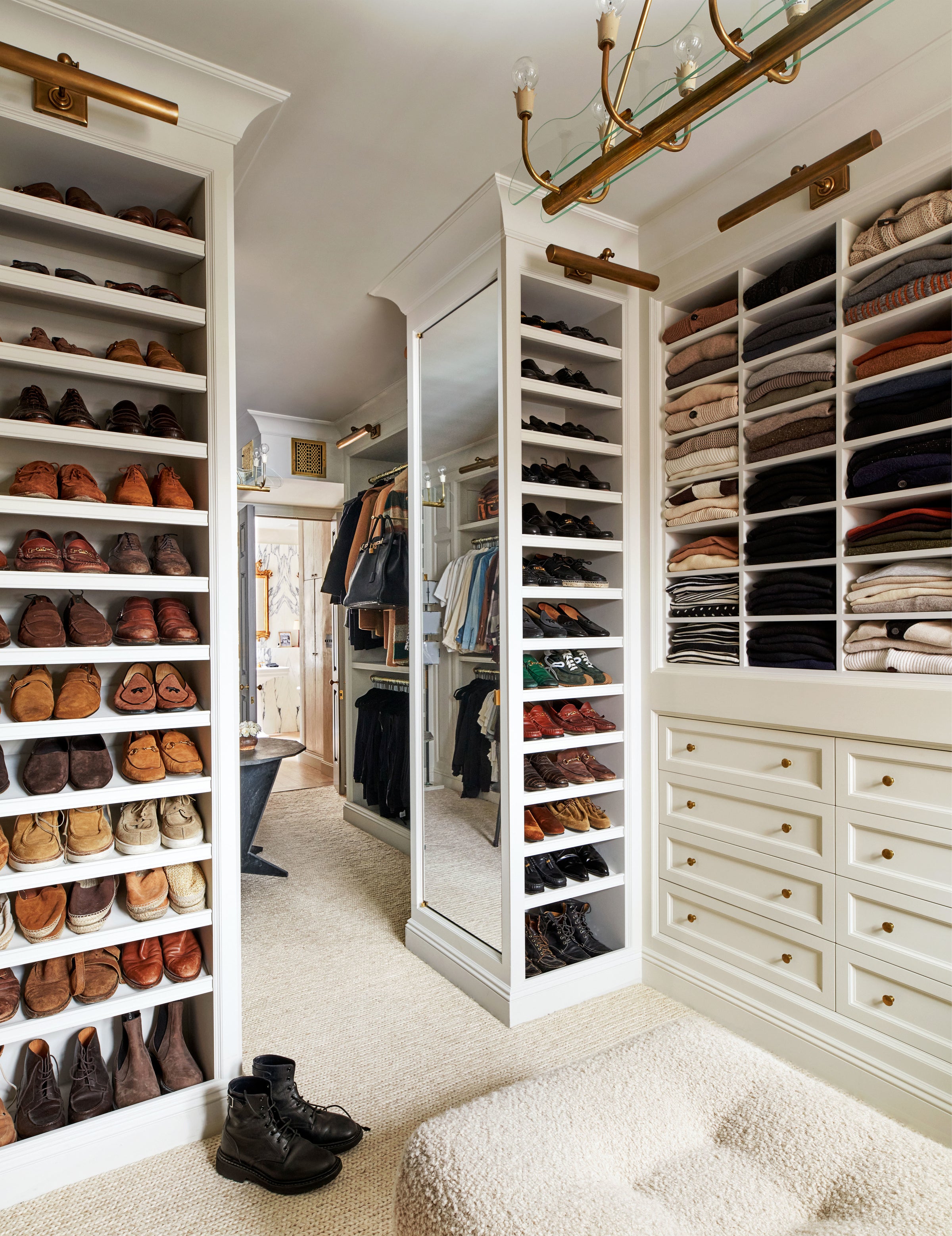 A custom walk-in closet with timeless finishes by Nate Berkus and Jeremiah Brent.