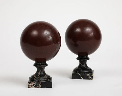 Pair of 19th Century Red Marble Spheres on Black Marble Stands