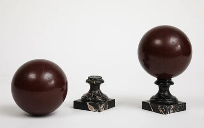 Pair of 19th Century Red Marble Spheres on Black Marble Stands