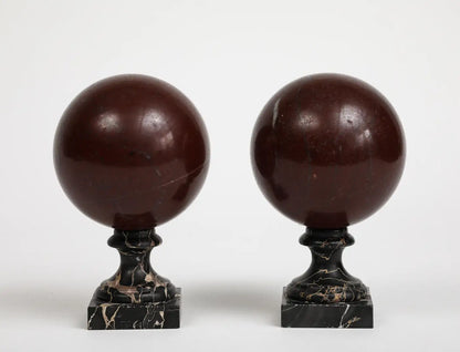 Pair of 19th Century Red Marble Spheres on Black Marble Stands