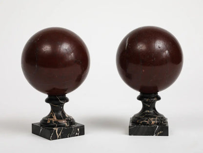 Pair of 19th Century Red Marble Spheres on Black Marble Stands