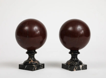 Pair of 19th Century Red Marble Spheres on Black Marble Stands