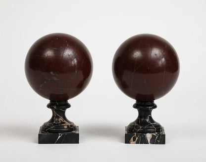 Pair of 19th Century Red Marble Spheres on Black Marble Stands