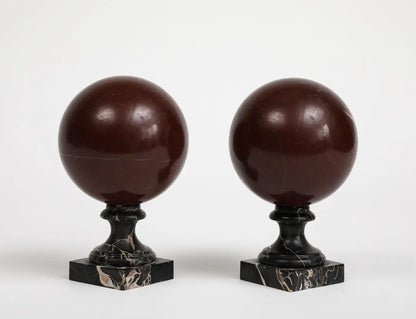 Pair of 19th Century Red Marble Spheres on Black Marble Stands
